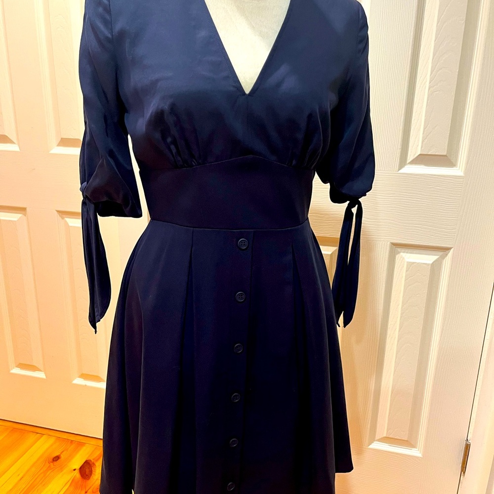 Fully lined, short sleeve dress with ties at sleeve
